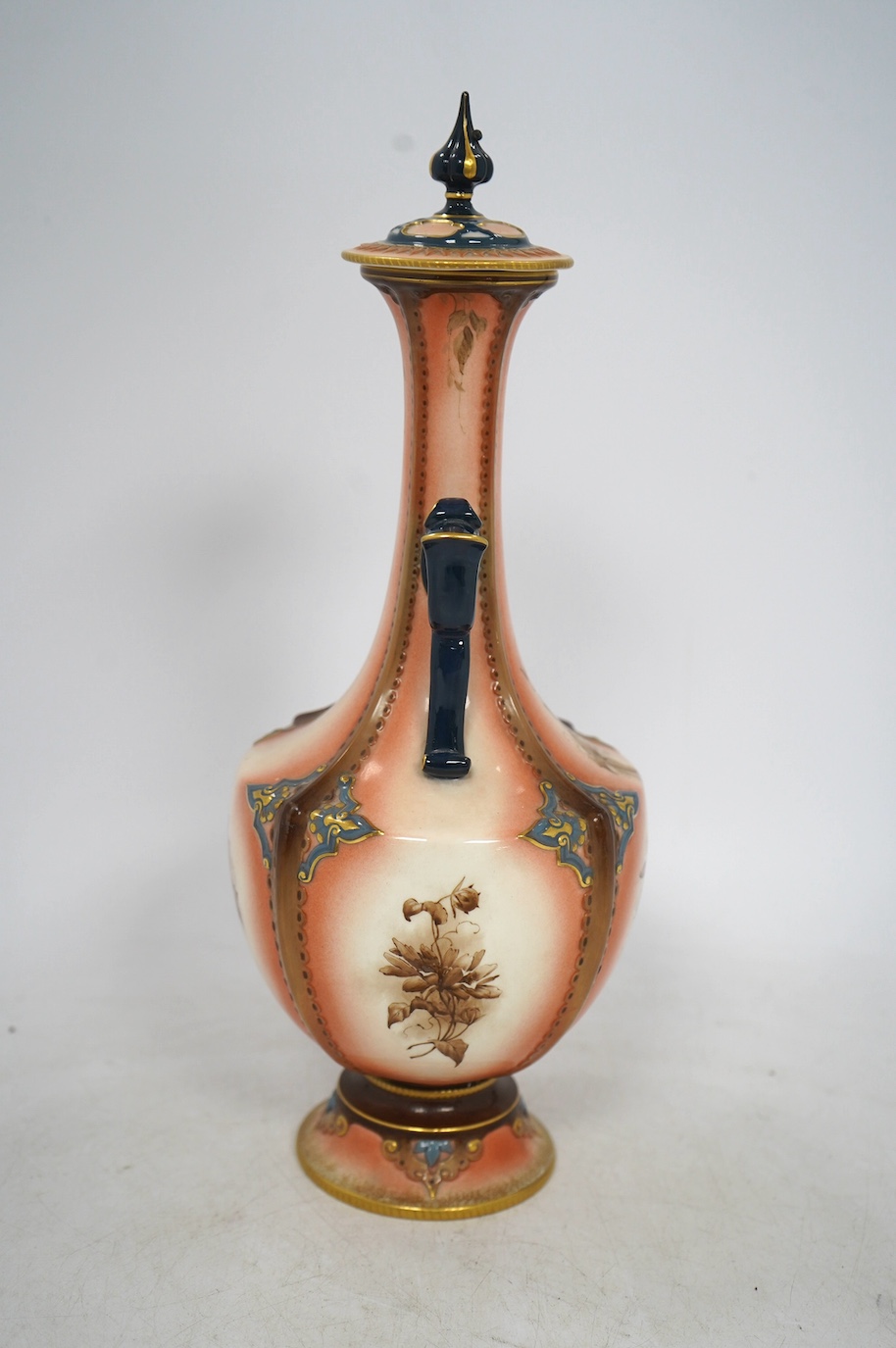 A Hadleys Worcester faience vase and cover, 31cm high. Condition - fair, the pommel on the lid has been broken and reattached